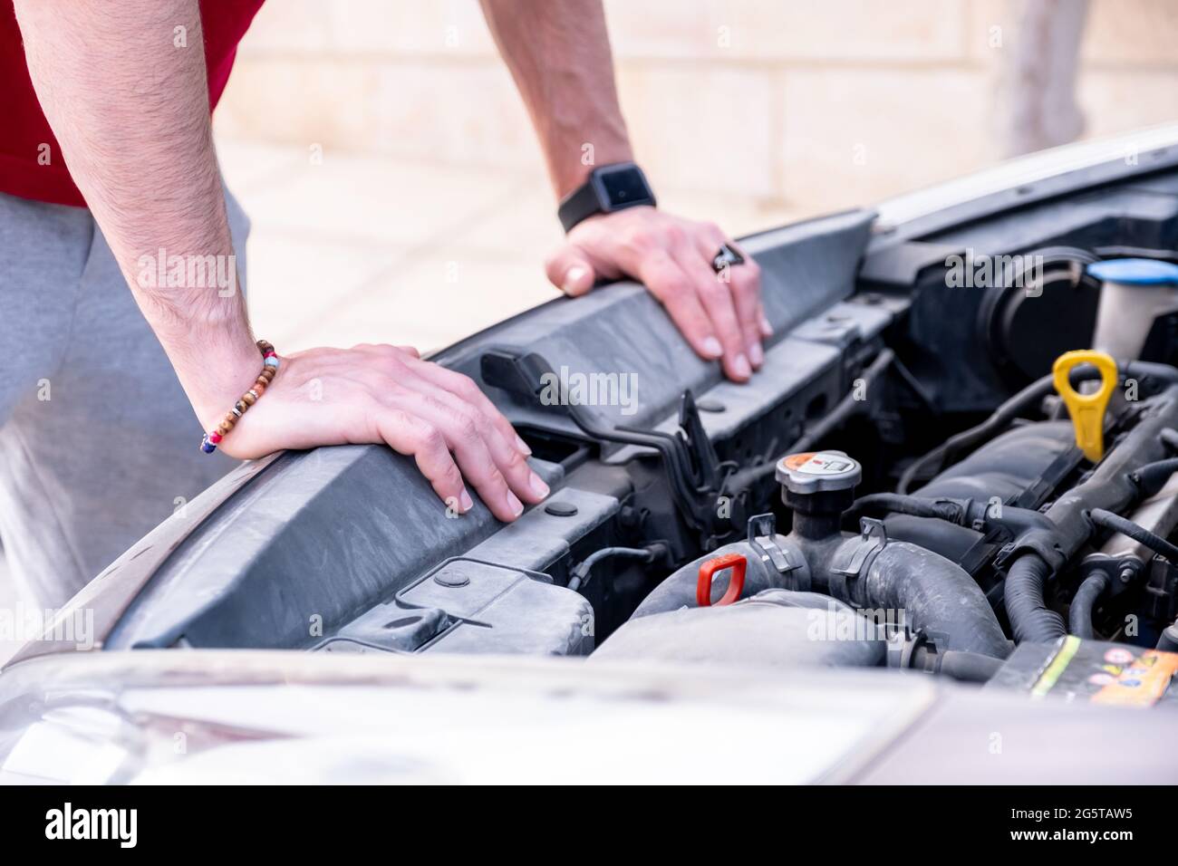 Man feeling worried due to his old gasoline car issue Stock Photo Alamy