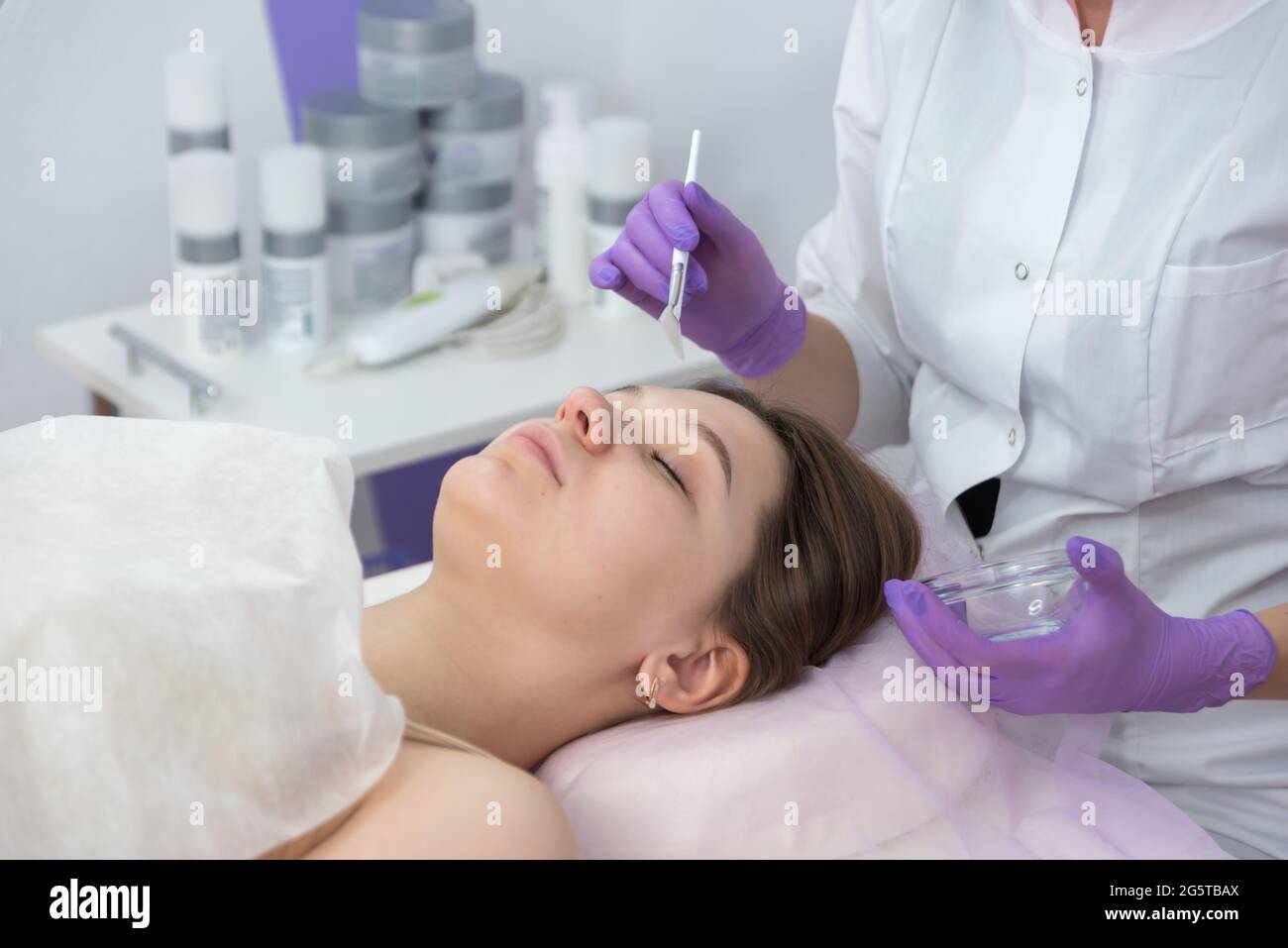 Facial brush peel retinol treatment. Beauty woman peeling procedure