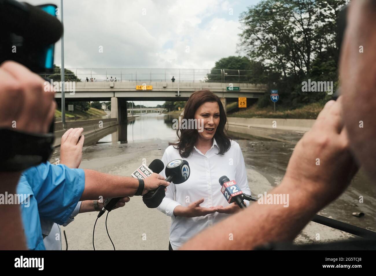 Detroit, US, 28/06/2021, Michigan Governor Gretchen Whitmer speaks to members of the press during a press conference held on the still inundated I-94 in Detroit. After a weekend of heavy storms beginning on Friday night and lasting through the weekend rainwater flooded parts of I-94 in Detroit, Michigan forcing some motorists to abandon their vehicles and seek shelter from the heavy rains. Flood waters remained in areas along I-94 between Dearborn and Downtown Detroit several days later as Michigan Governor Gretchen Whitmer held a press conference on the still inundated I-94. Stock Photo