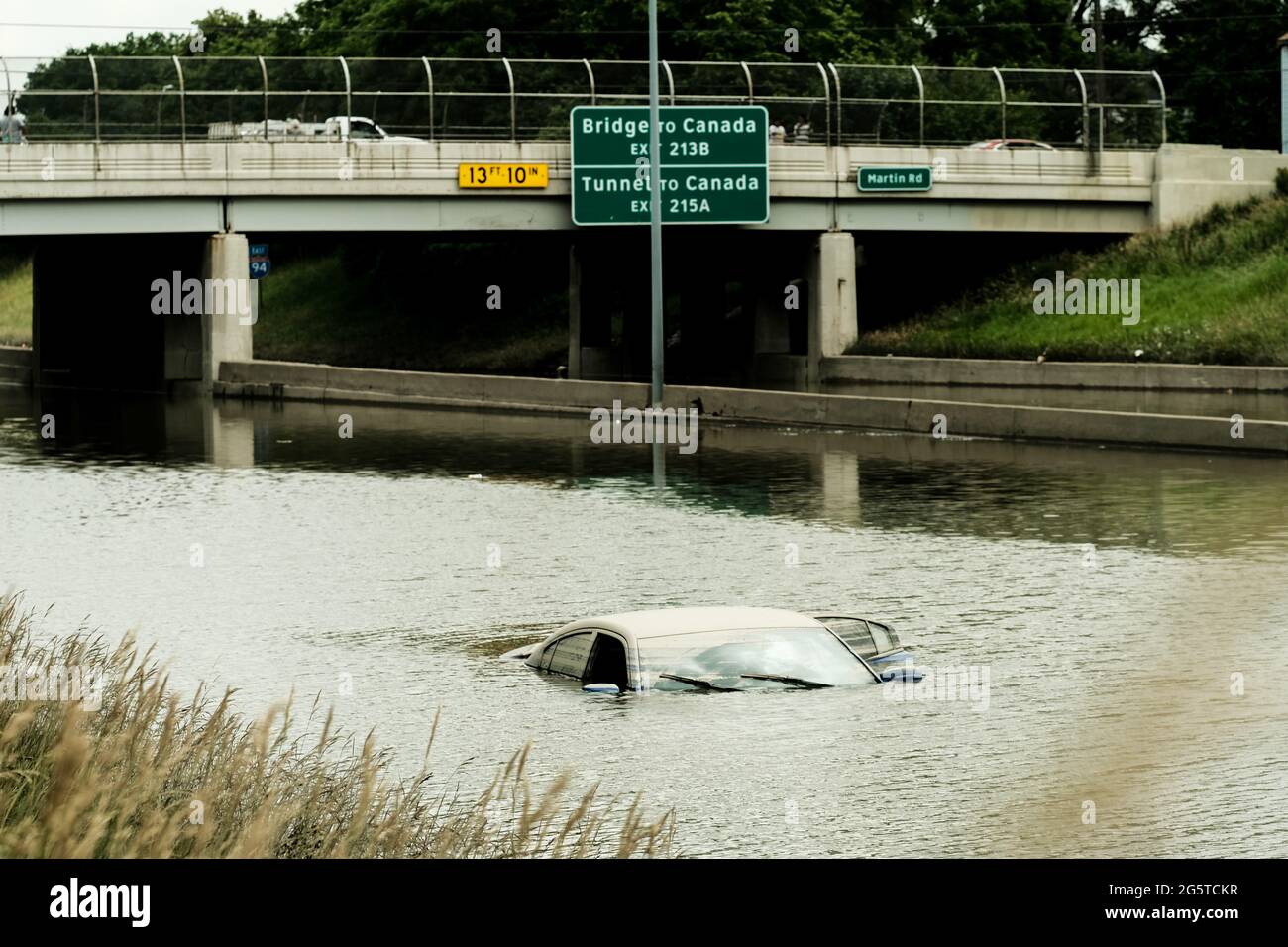 Car remains inundated in floodwaters on a flooded portion of I-94 in Detroit, Michigan several days after heavy rains flooded parts of the city. After a weekend of heavy storms beginning on Friday night and lasting through the weekend rainwater flooded parts of I-94 in Detroit, Michigan forcing some motorists to abandon their vehicles and seek shelter from the heavy rains. Flood waters remained in areas along I-94 between Dearborn and Downtown Detroit several days later as Michigan Governor Gretchen Whitmer held a press conference on the still inundated I-94. (Photo by Matthew Hatcher/SOPA I Stock Photo