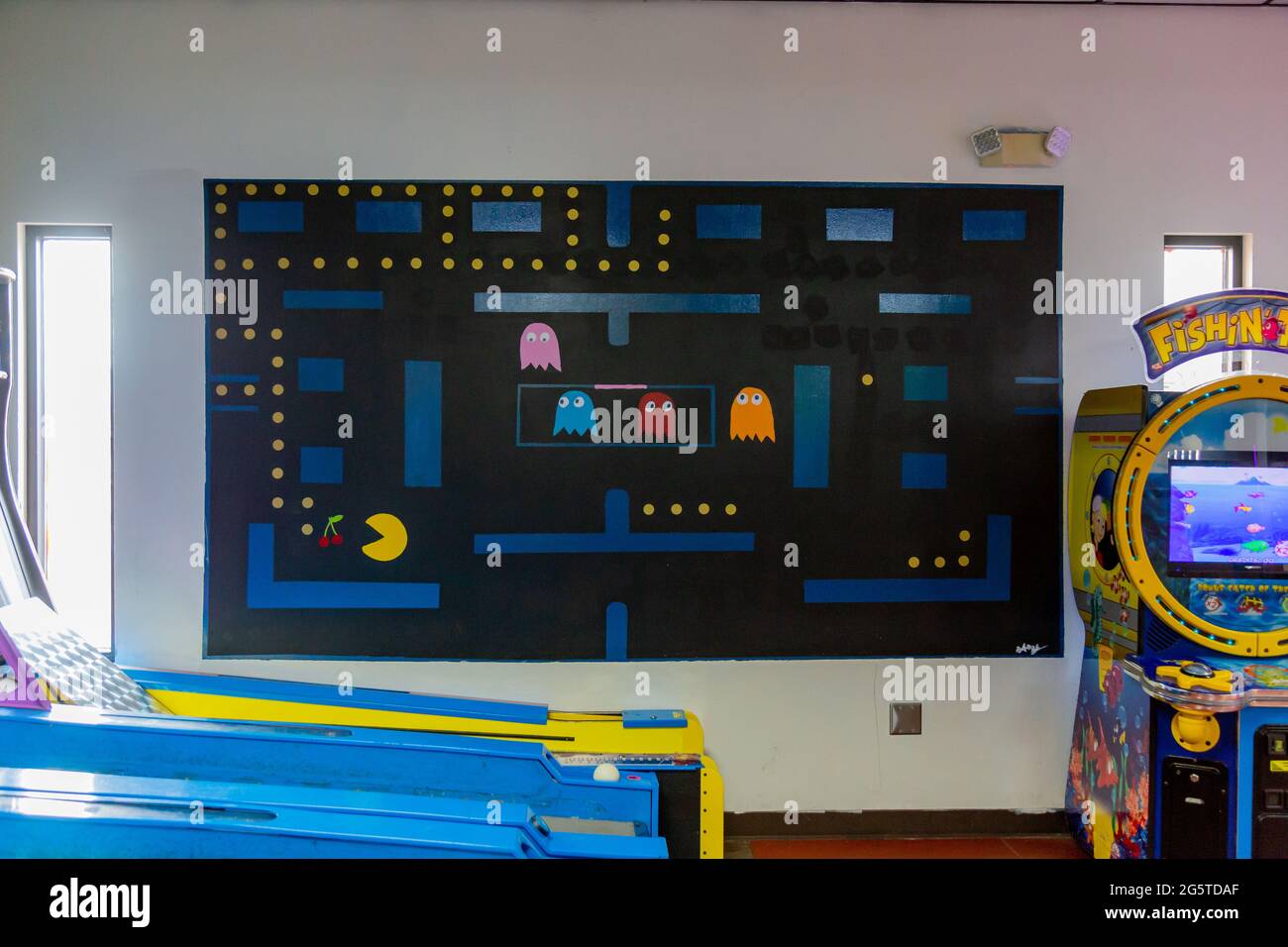A painting of a Pac Man video game hangs on the wall of Putt Putt Golf and Games in Fort Wayne, Indiana, USA. Stock Photo