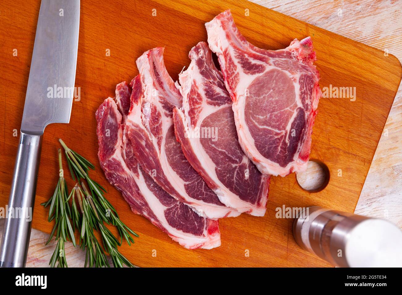 Preparation of raw pork loin Stock Photo Alamy