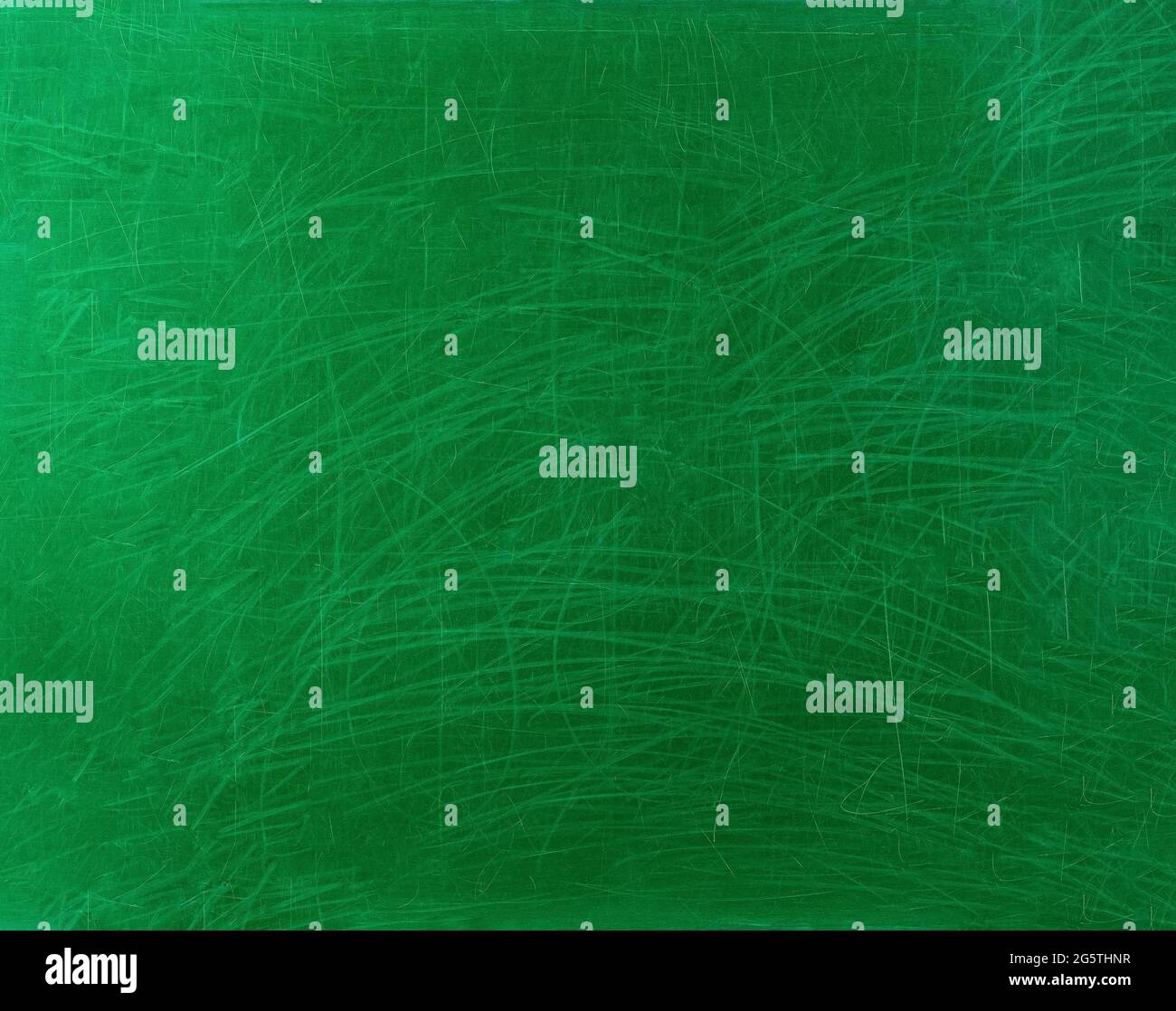 Old school chalkboard scratched in green. With traces of worn paint and chalk scratches. Gradient from edge to middle. Background. Stock Photo