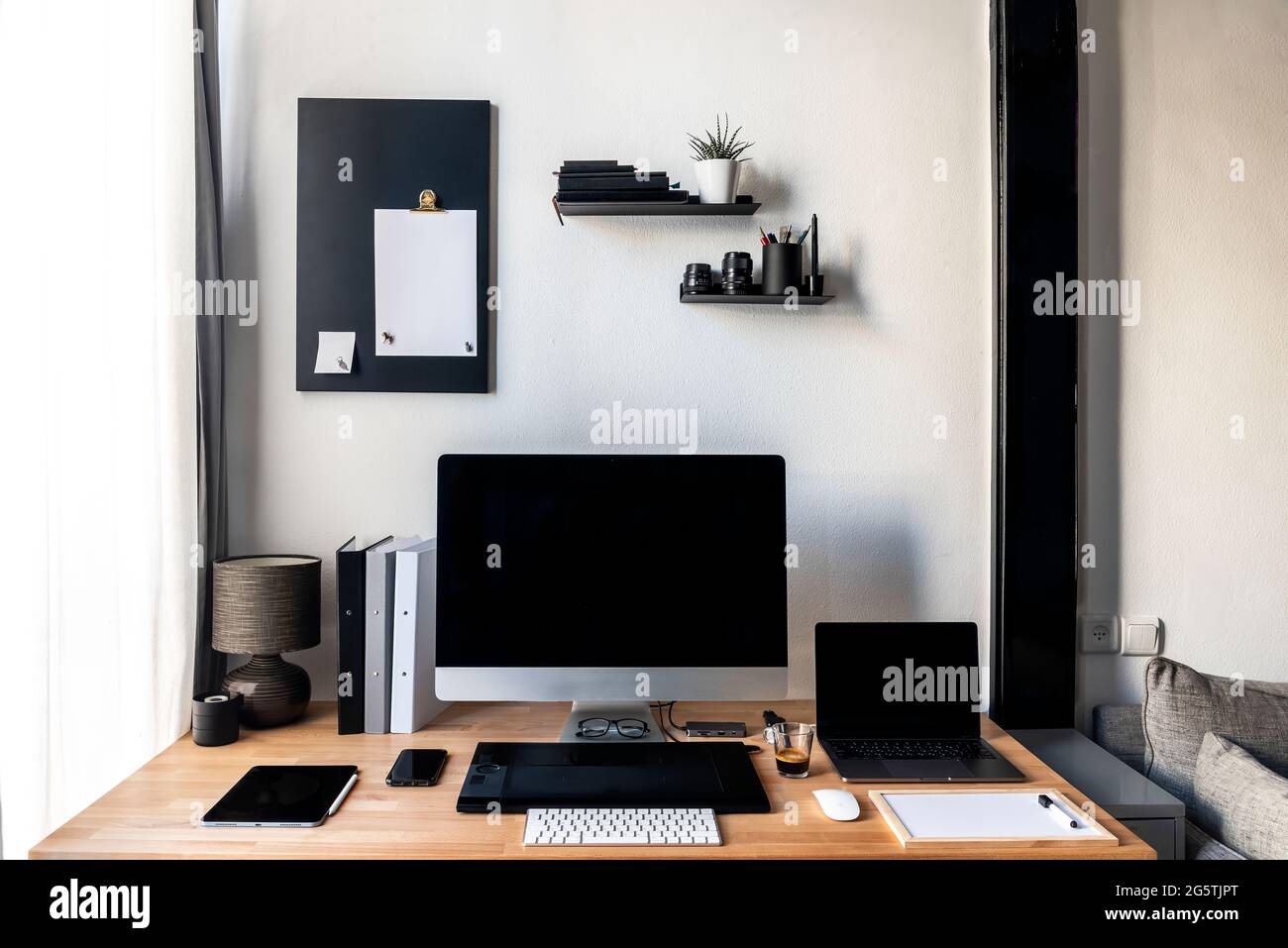 Top view of a wooden desk with office supplies placed. High quality