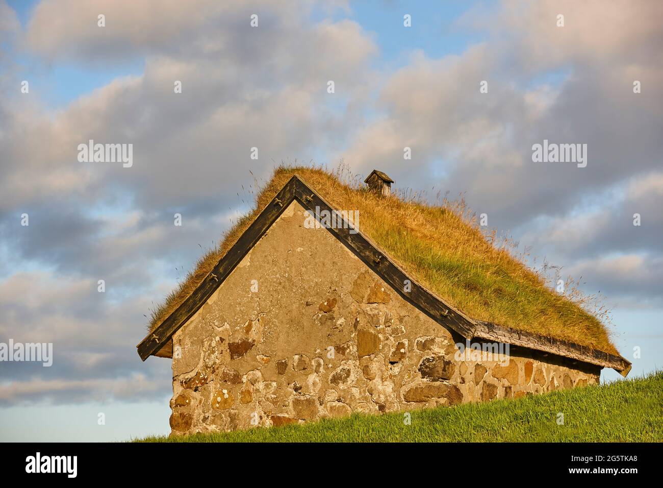 Traditional stone house with turf roof in Faroe islands. Denmark Stock Photo