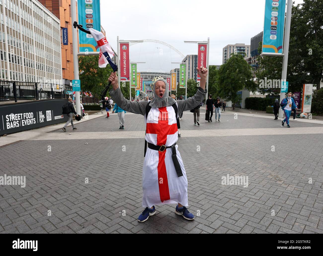 London, UK. 29th June, 2021. An England fan dressed up in the flag of ...