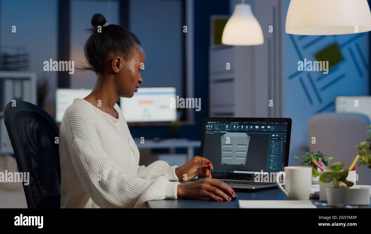 Enthusiastic african engineer analysing cad software to design a 3D ...