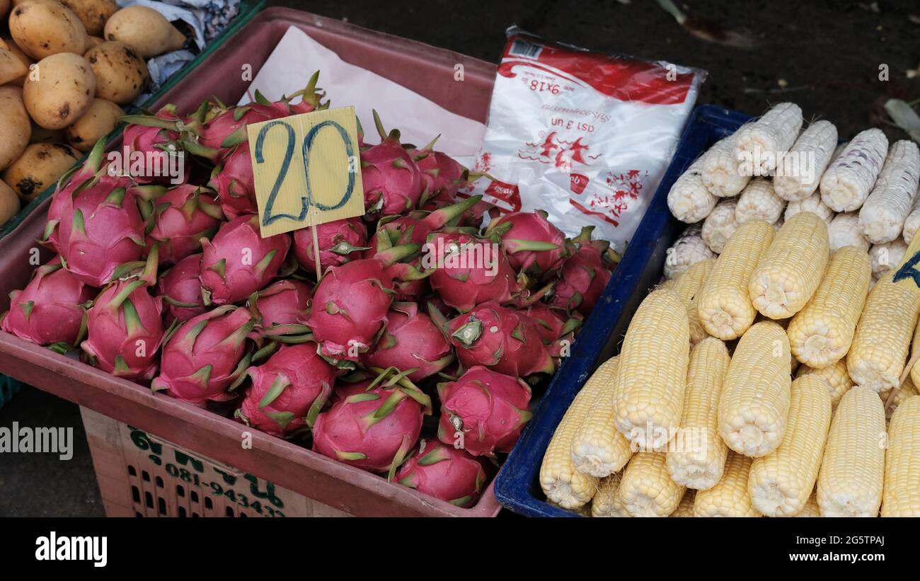 Dragon Fruit Corn Mangoes Klong Toey Market Wholesale Wet Market Bangkok Thailand largest food distribution center in Southeast Asia Stock Photo