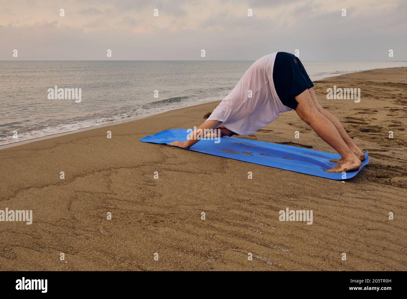 Downward facing dog man hires stock photography and images Alamy