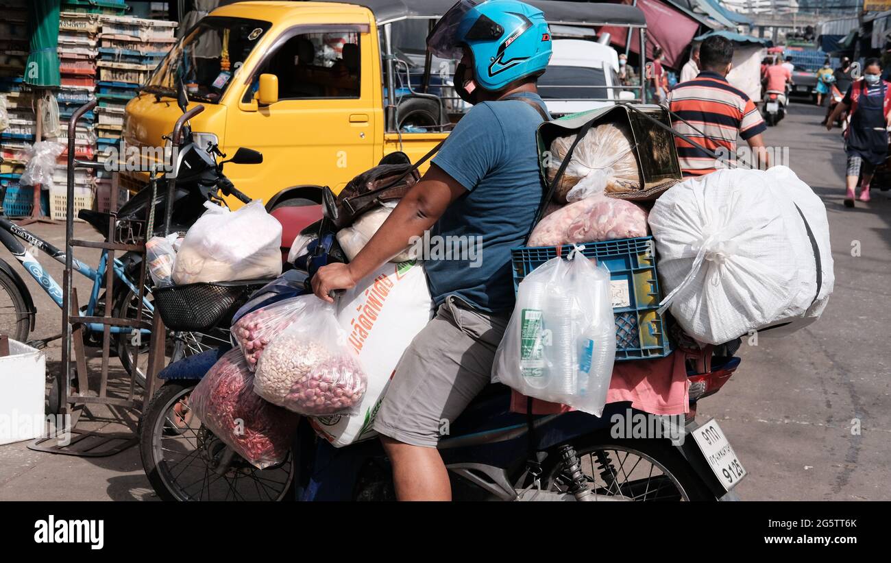 Overloaded Motorbike Klong Toey Market Wholesale Wet Market Bangkok Thailand largest food distribution center in Southeast Asia Stock Photo