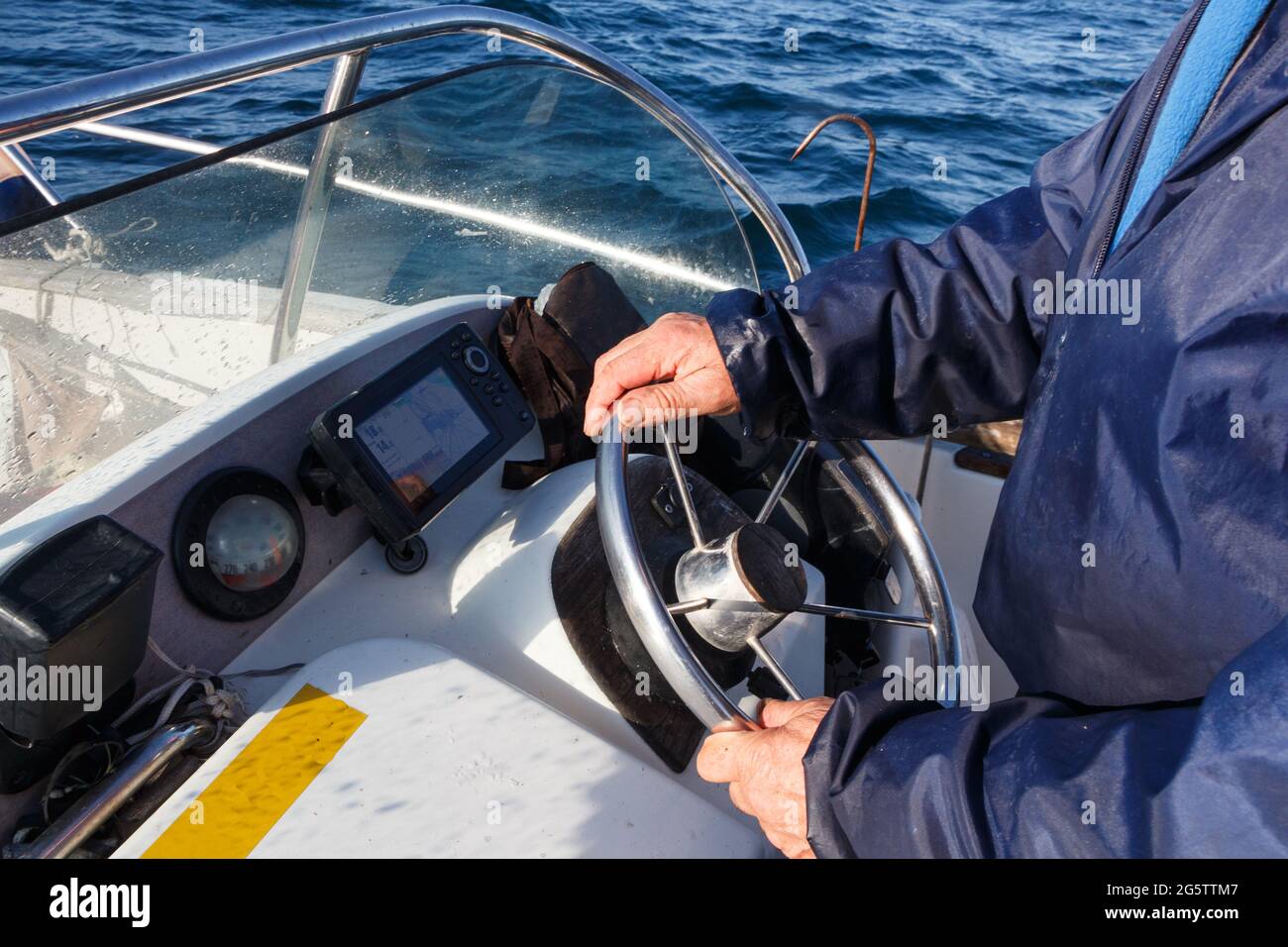 Steering a boat hi-res stock photography and images - Alamy