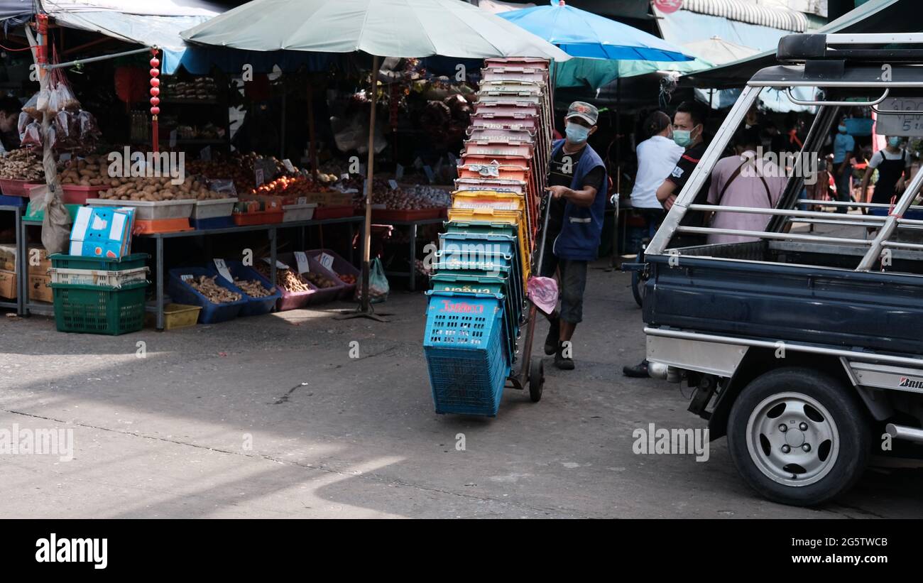 Plastic Baskets on a Hand Truck Klong Toey Market Wholesale Wet Market Bangkok Thailand largest food distribution center in Southeast Asia Stock Photo