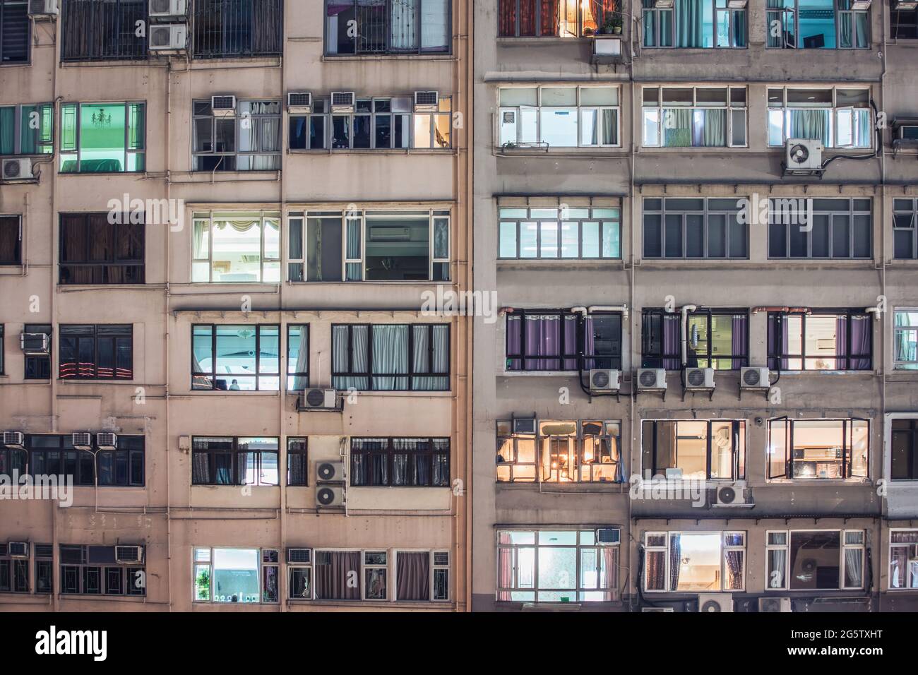 Exterior of old buildings in Kowloon, Hong Kong, at night Stock Photo