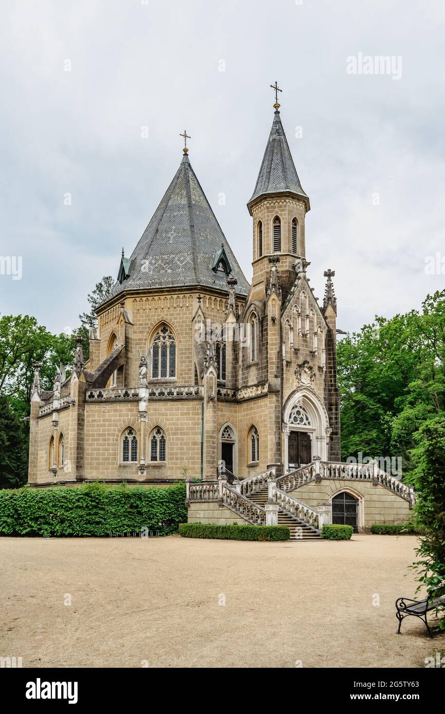 Spring view of Schwarzenberg Tomb near Trebon, Czech Republic.Neo-gothic building with tower and majestic double staircase is surrounded by park Stock Photo