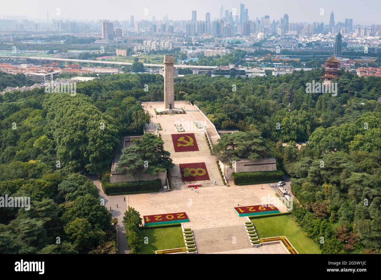 Nanjing, Nanjing, China. 30th June, 2021. On June 29, 2021, in front of the Martyrs Monument in the Yuhuatai Martyrs Cemetery in Nanjing, a large-scale theme flower landscape composed of tens of thousands of pots of flowers was arranged to celebrate the 100th anniversary of the founding of the Communist Party of China. Credit: SIPA Asia/ZUMA Wire/Alamy Live News Stock Photo