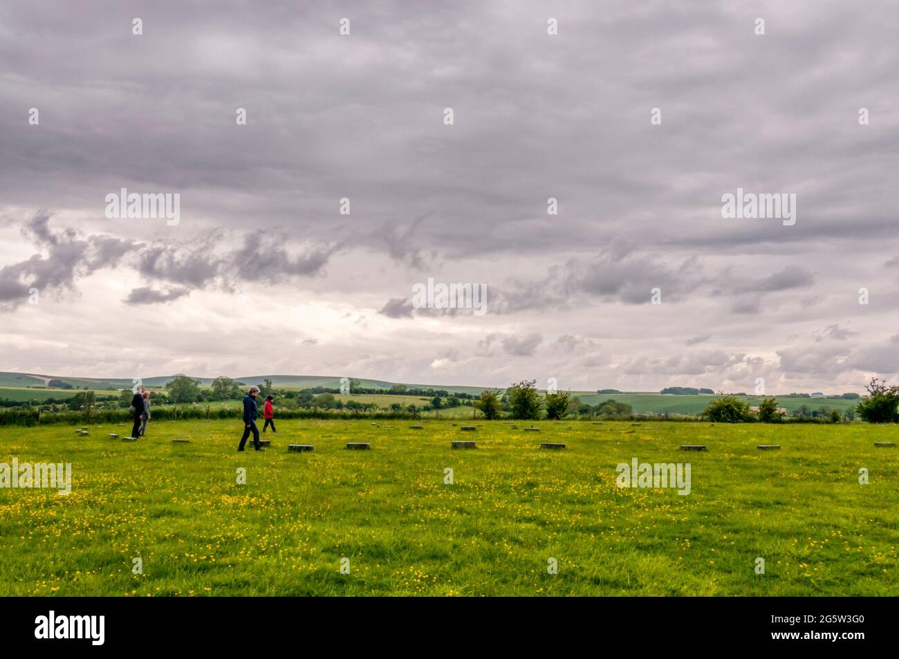 Tourists at The Sanctuary Iron Age site near Avebury, Wiltshire. Stock Photo