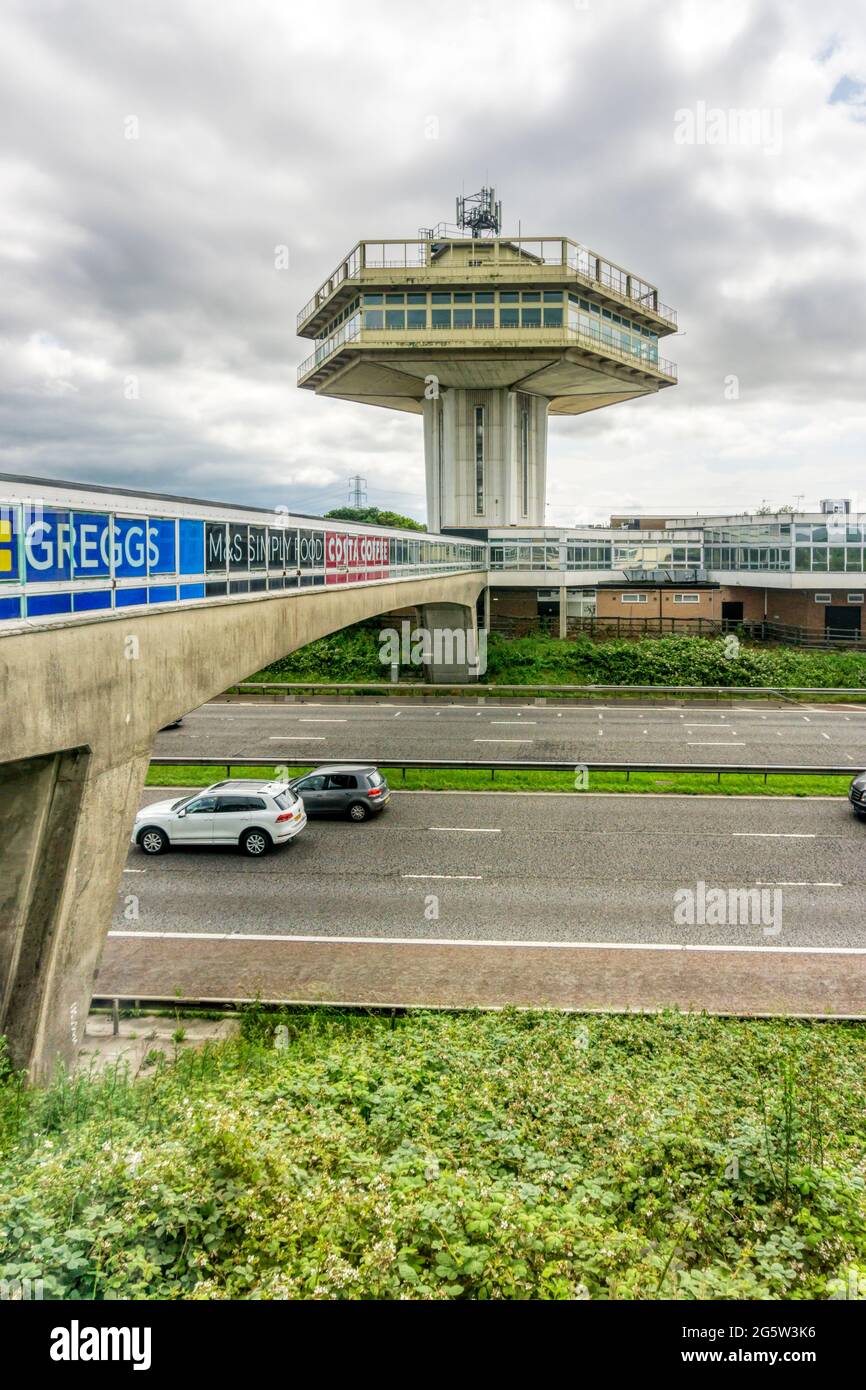 Brutalist architecture of the Pennine Tower & concrete bridge of Lancaster Forton Services on the M6 motorway opened in 1965. Stock Photo