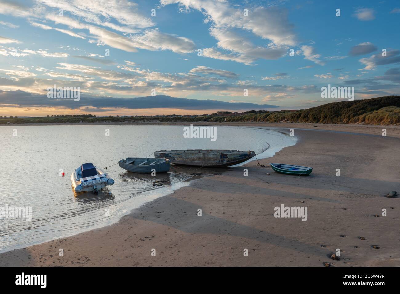 Boats moored on the beach at Beadnell in Northumberland Stock Photo