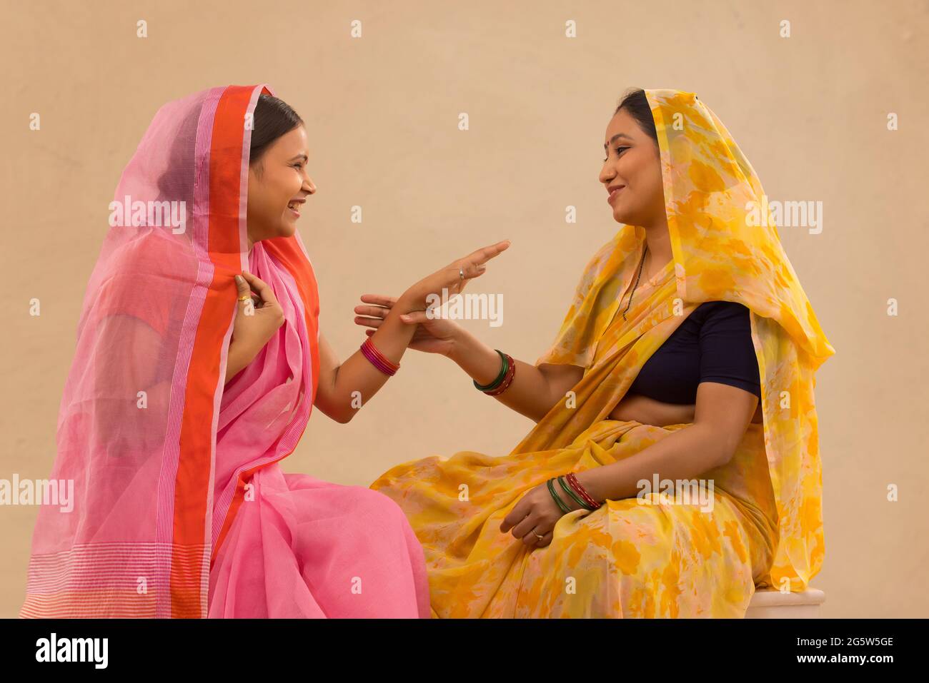 Two rural women talking to each other. Stock Photo