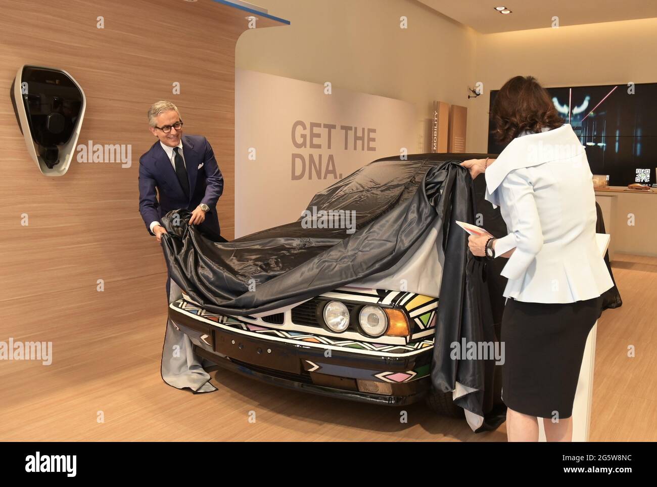 Milan, Italy. 30th June, 2021. Milan, Italy BMW Milano Urban Store The  speed of the arts. Science Massimiliano Di Silvestre president of AD BMW  Italia presents the BMW 525i from 1991 created