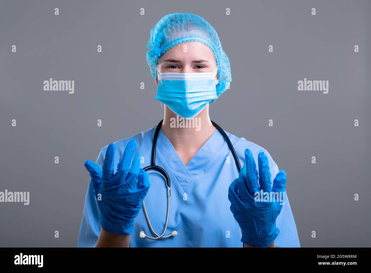 Portrait of caucasian female doctor wearing face mask and medical