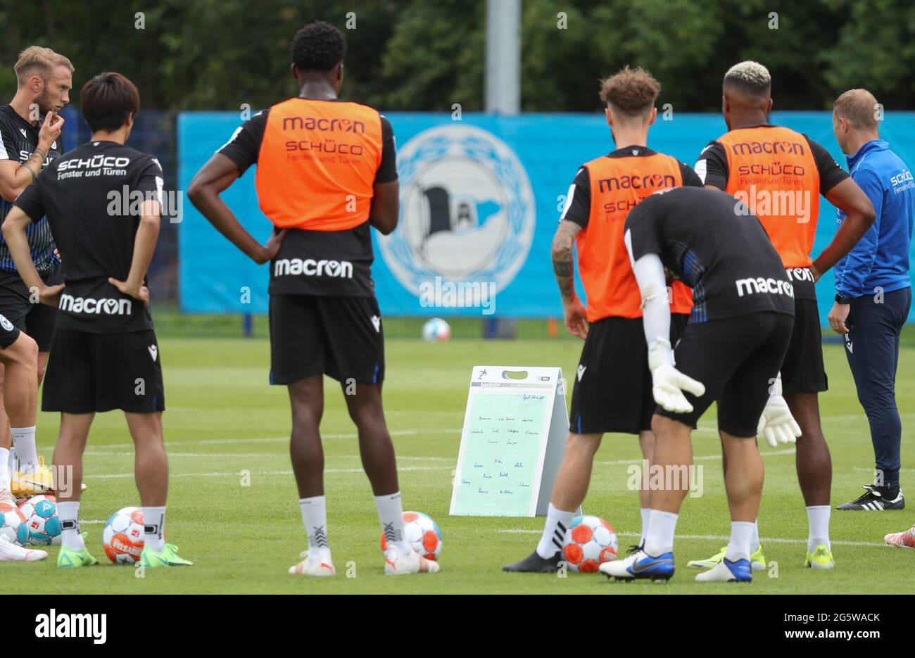 Bielefeld, Germany. 30th June, 2021. Football: Bundesliga, training  kick-off DSC Arminia Bielefeld. Players and coaching staff stand on the  grass from the training ground at the first training session of the season.