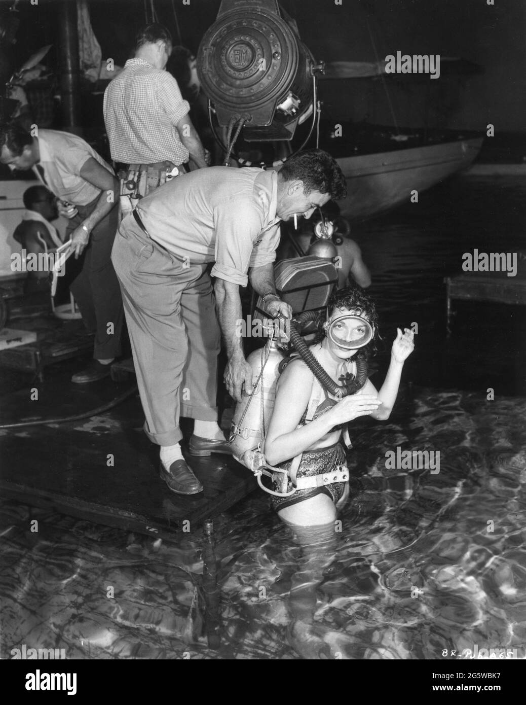 JANE RUSSELL on set candid with Movie Crew during filming of UNDERWATER ! 1955 director JOHN STURGES filmed in SuperScope executive producer Howard Hughes RKO Radio Pictures Stock Photo