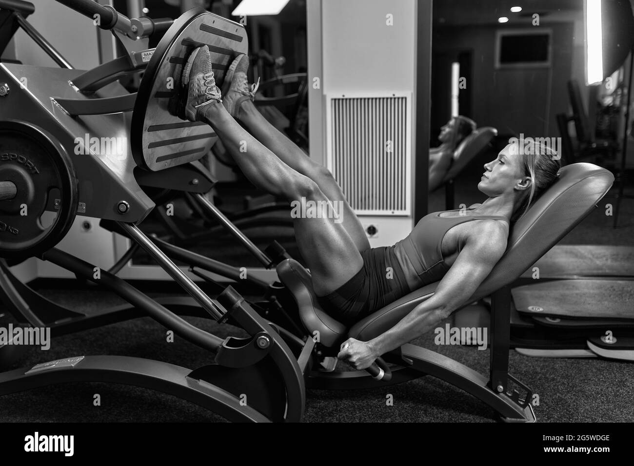 Leg lift gym machine Black and White Stock Photos Images Alamy