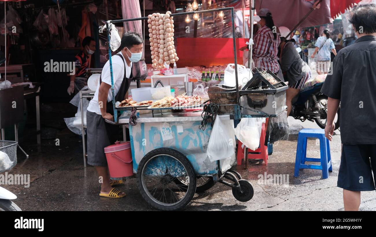 Klong Toey Market Wholesale Wet Market Bangkok Thailand largest food distribution center in Southeast Asia Man with push cart Stock Photo