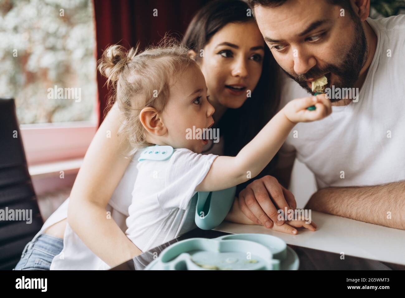 https://c8.alamy.com/comp/2G5WMT3/little-child-feeds-his-father-with-spoon-2G5WMT3.jpg