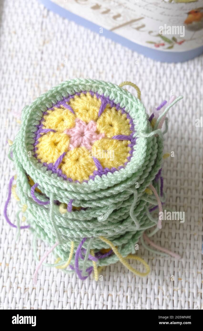 A pile of crocheted African Flower Hexagons waiting to be joined up Stock Photo