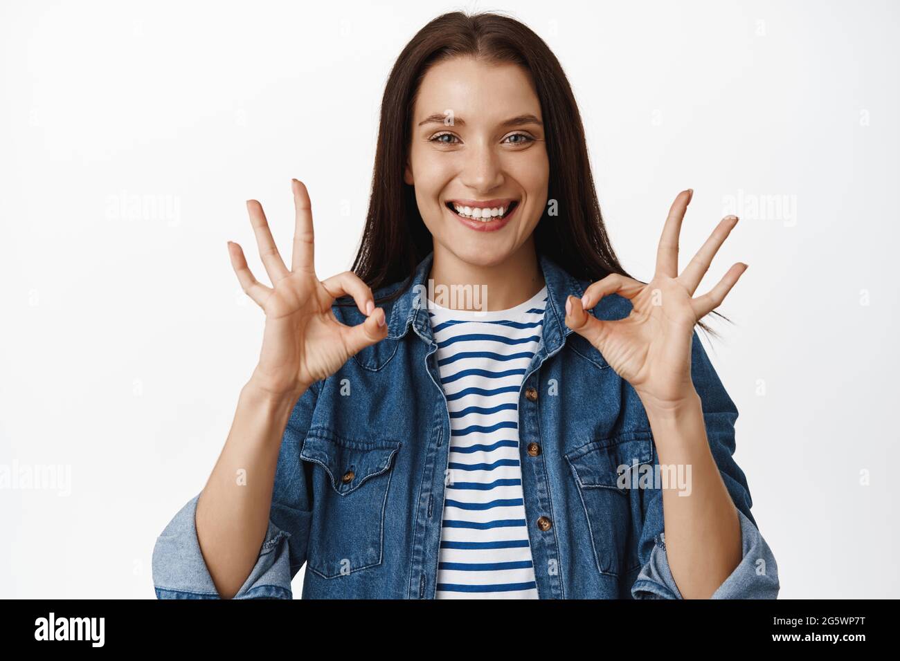 No problem, yes its alright. Smiling young woman looks satisfied, shows ...