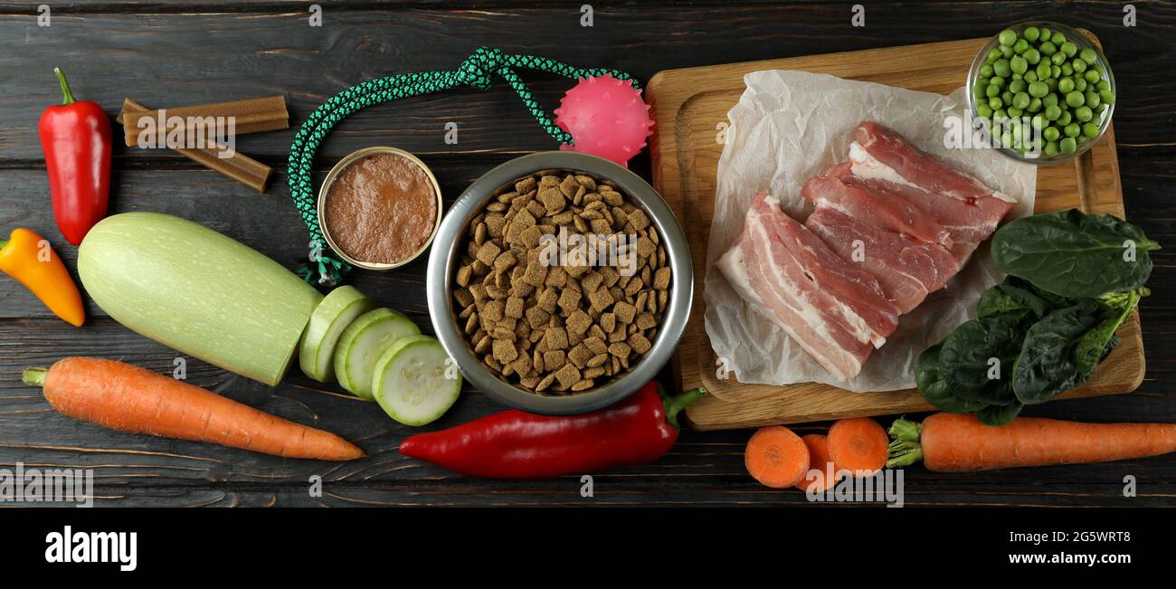 Concept of organic pet food on wooden background Stock Photo