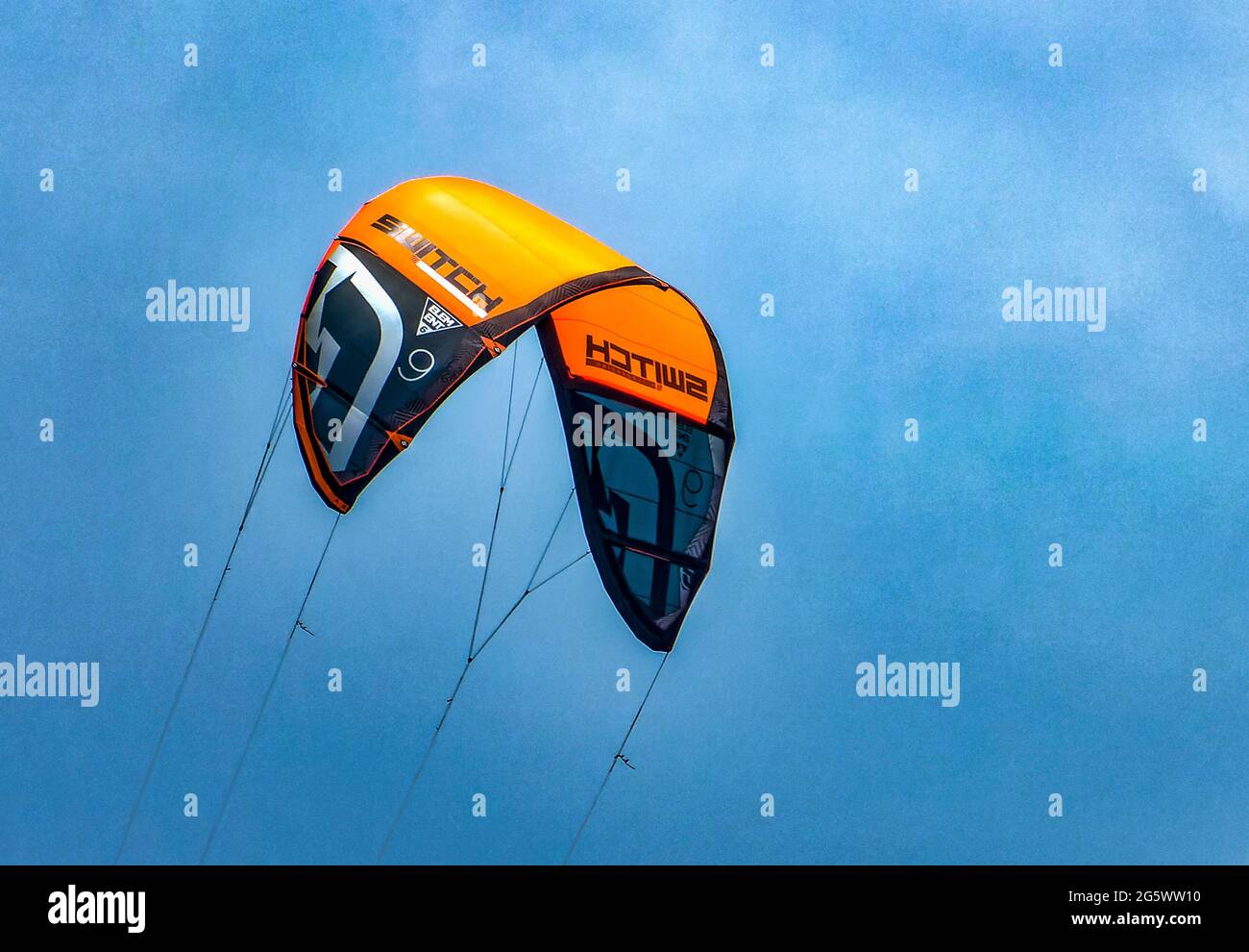 Wind Surfing sail billowing in the clear sky Stock Photo Alamy