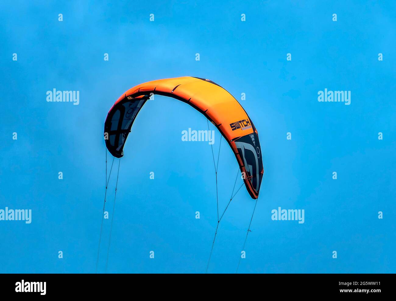Wind Surfing sail billowing in the clear sky Stock Photo Alamy