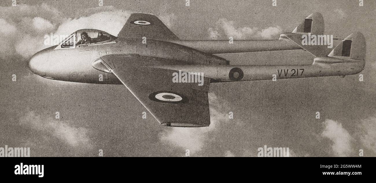 A 1940's printed photo of a Vampire fighter jet VV271in flight showing its pilot at the controls posing for the photographer - The de Havilland Vampire was a British jet aircraft   developed and manufactured by the de Havilland Aircraft Company and used by the Royal Airforce, their second jet fighter following the Gloster Meteor. It was also used by the Royal Navy Stock Photo
