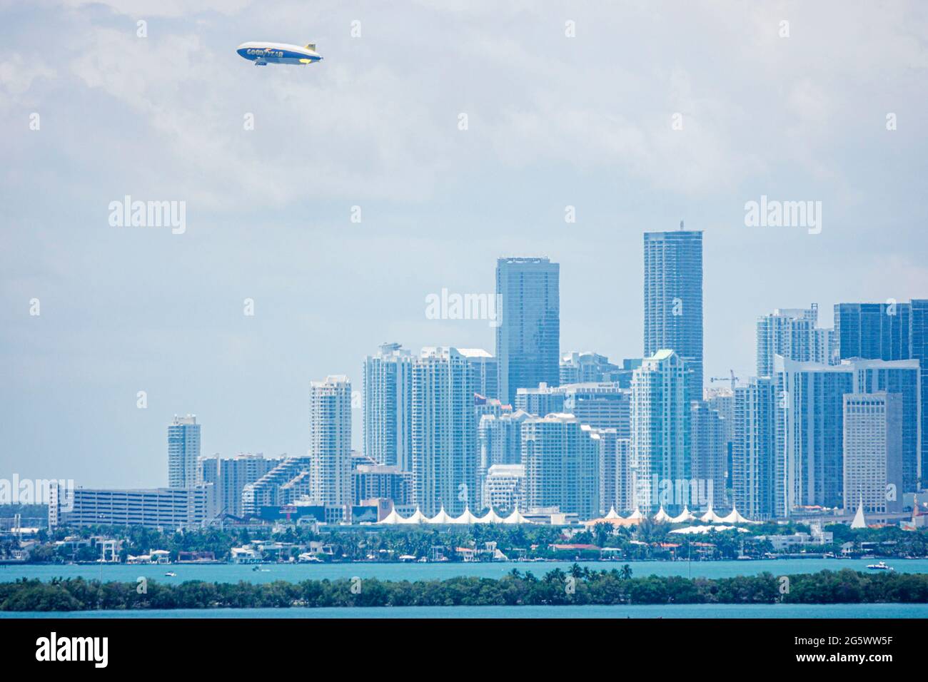 Florida Miami Biscayne Bay downtown city skyline tall buildings skyscrapers towers Goodyear Blimp Stock Photo