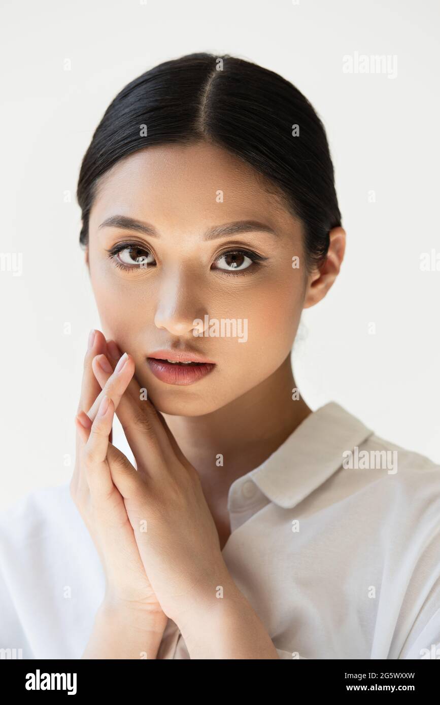 Portrait of japanese woman in white shirt isolated on grey Stock Photo ...