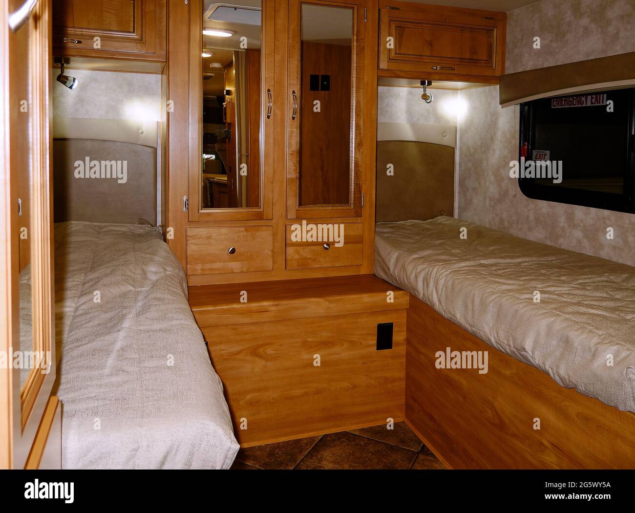 motorhome bedroom, twin beds, wardrobe, mirrored doors, drawers, cabinets, reading lights, class C recreational vehicle, RV, transportation, camper, N Stock Photo