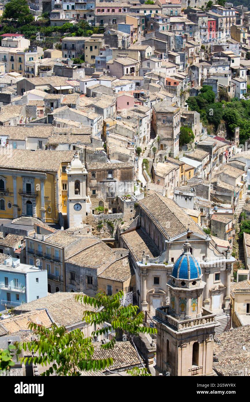 Ragusa, Sicily, Italy. High angle view over the rooftops of Ragusa Ibla, bell-tower of the Church of Santa Maria dell'Itria in foreground. Stock Photo