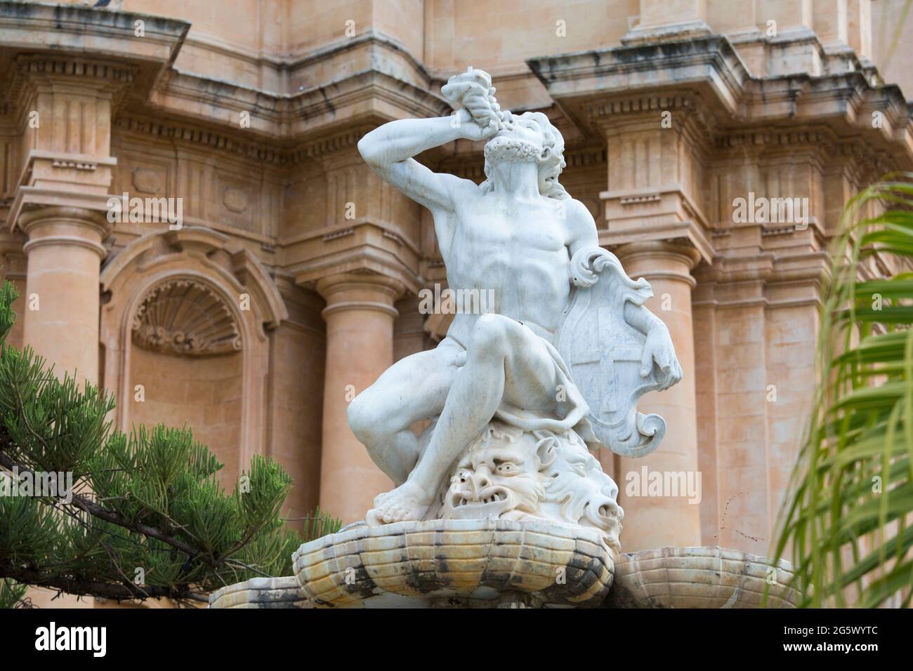 Noto, Syracuse, Sicily, Italy. Finely carved figure forming part of the 18th century Fountain of Hercules in front of the Church of San Domenico. Stock Photo