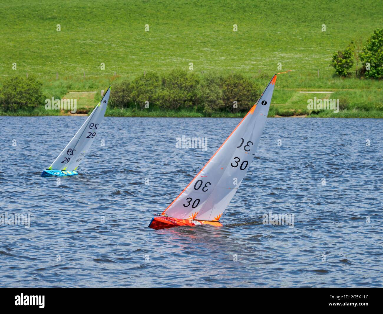 two Radio controlled yachts racing on Tamar Lakes, Devon, UK Stock ...