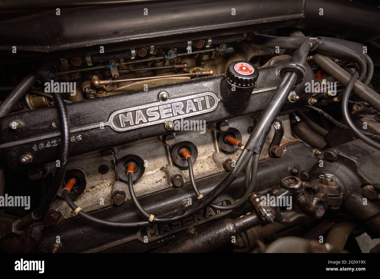 View of the engine of a blue 1971 Maserati 4700 Indy America V8 - Stock Image