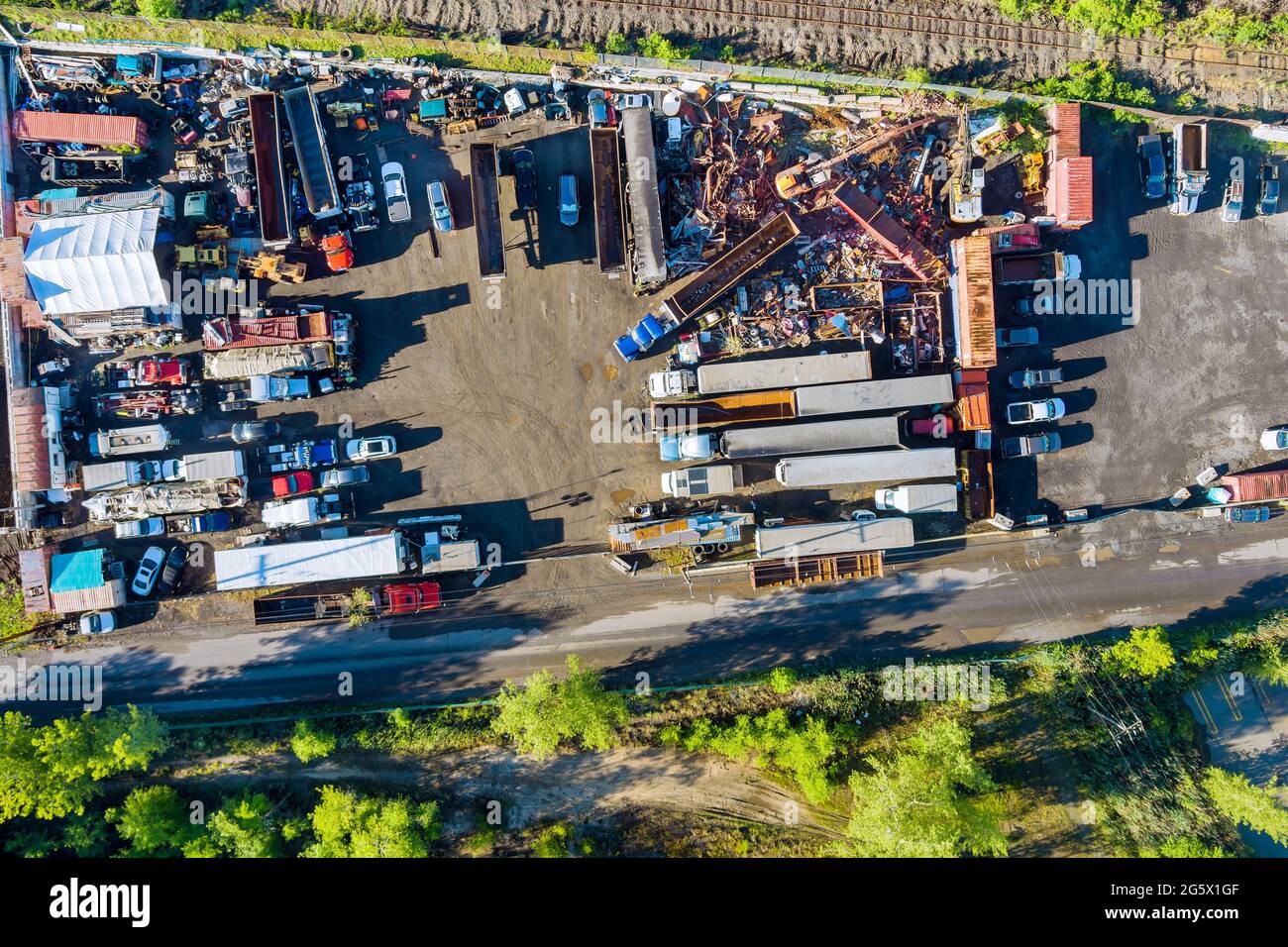 Aerial panoramic view metal scrap as waste collected in a part at junkyard scrap yard for recycling Stock Photo