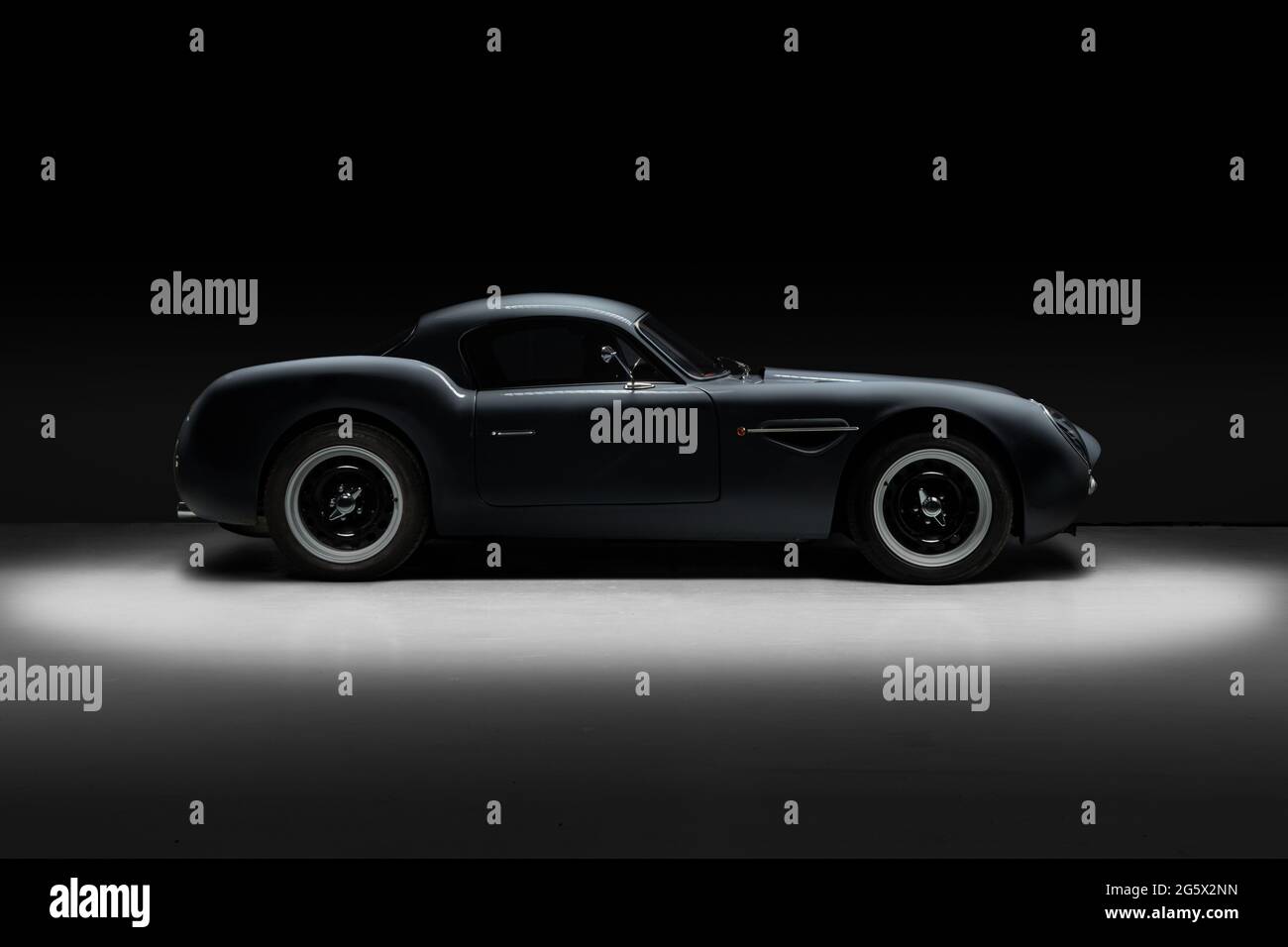 Highlighted side view of a grey 2018 handbuilt Dowsetts Comet 6.2 V8 sports car - Stock Image