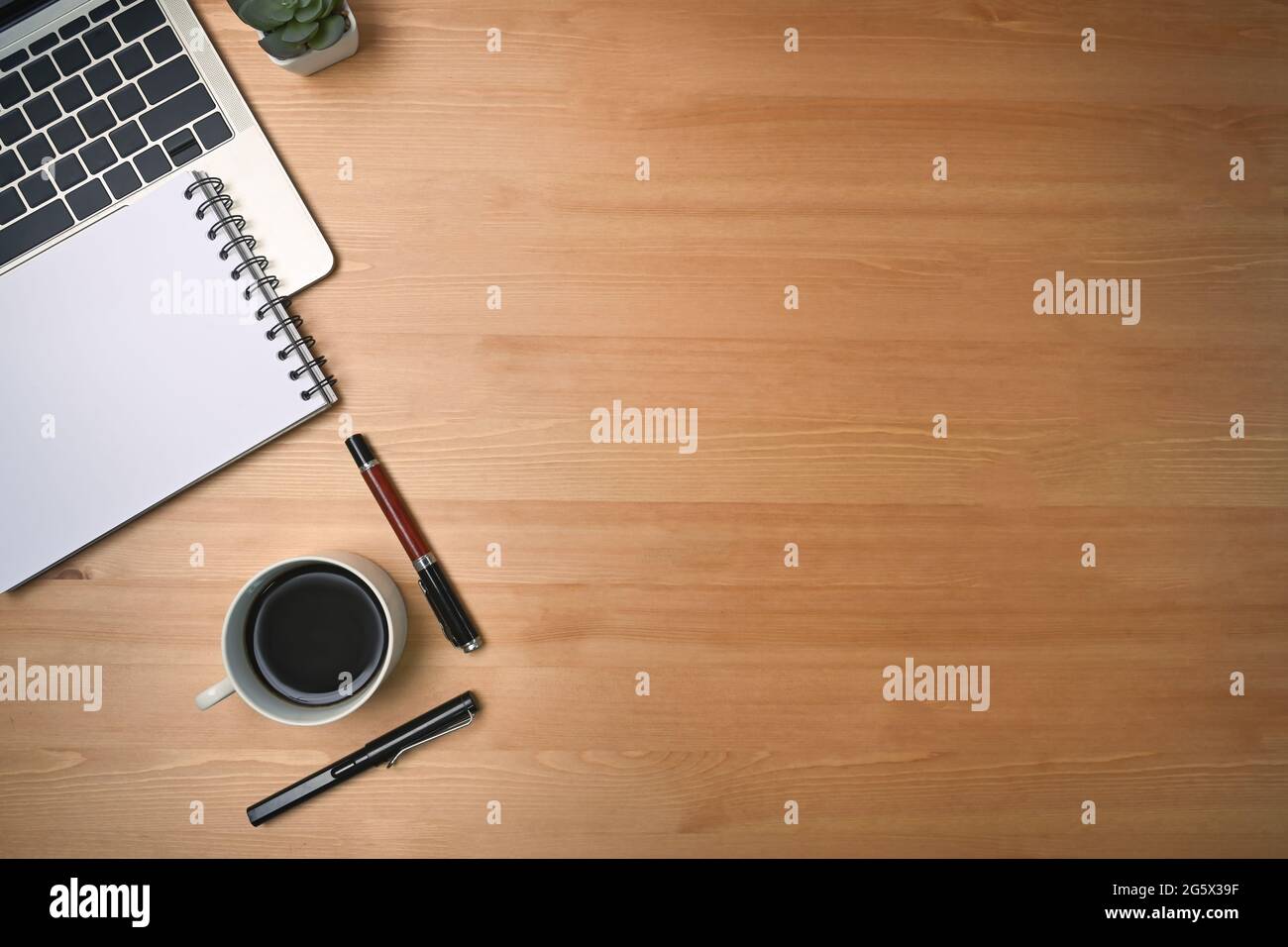 Mock up computer laptop, notepad and coffee cup on wooden background ...