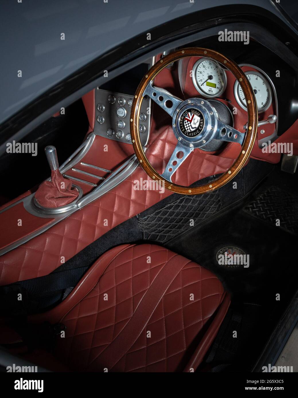 View of red interior of a grey 2018 Dowsetts Comet 6.2 V8 sports car - Stock Image