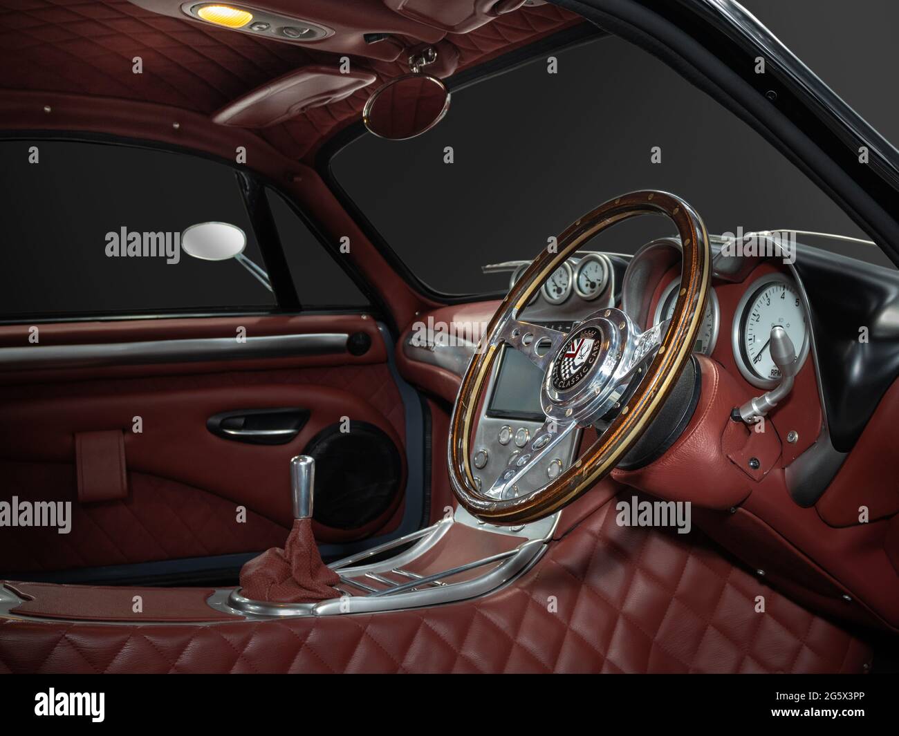 View of red interior of a grey 2018 Dowsetts Comet 6.2 V8 sports car - Stock Image