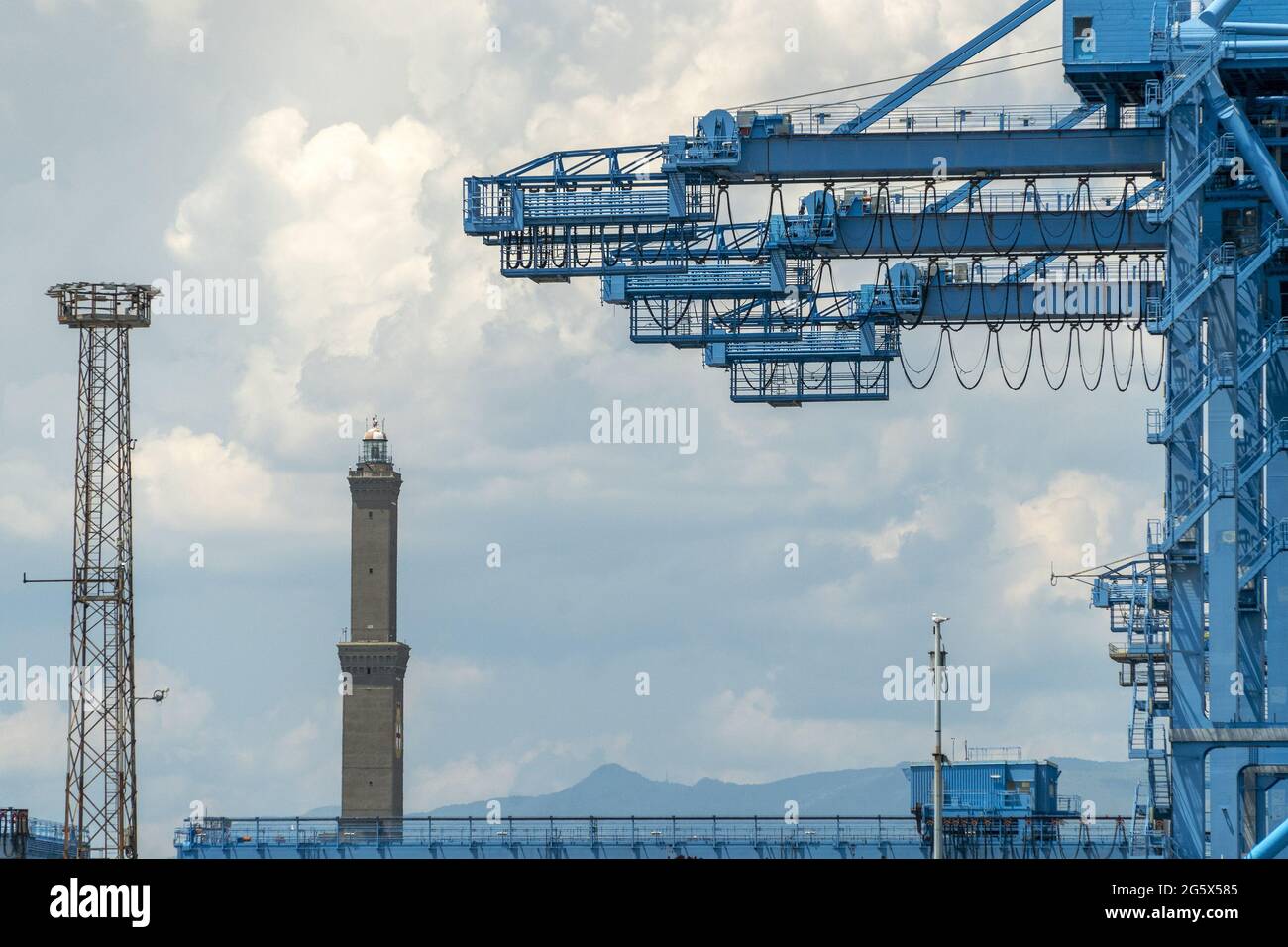 genoa lanterna lighthouse harbour working place with containers ship ...