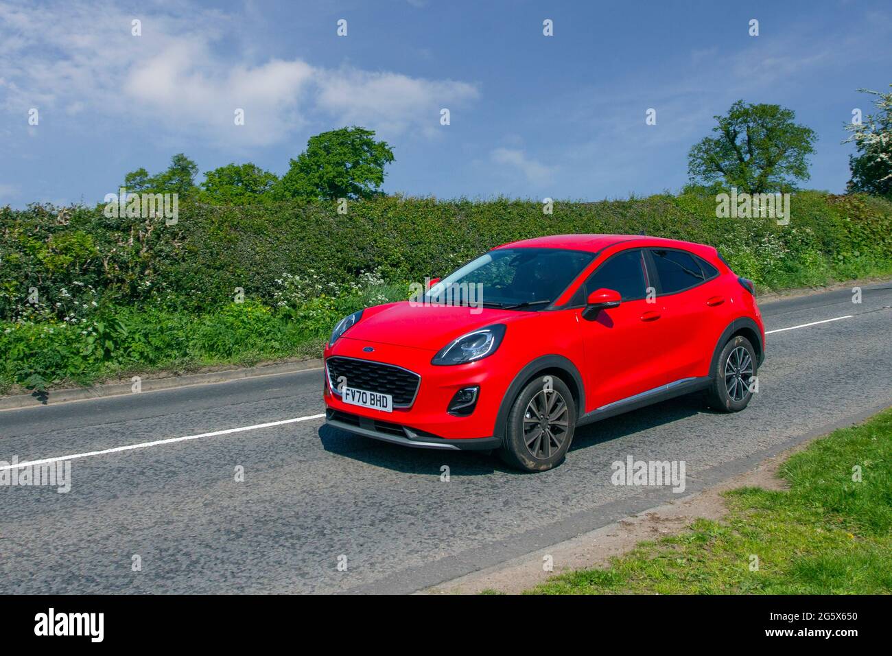 2020 red Ford Puma Titanium 999 cc petrol 4dr three-cylinder engine saloon  en-route to Capesthorne Hall classic May car show, Cheshire, UK Stock Photo  - Alamy